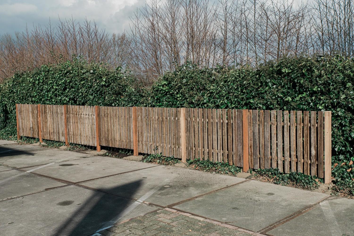  Wooden fencing developed with old stable grids